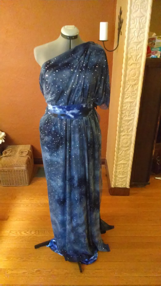 A one shoulder dress with star mesh over cloud fabric